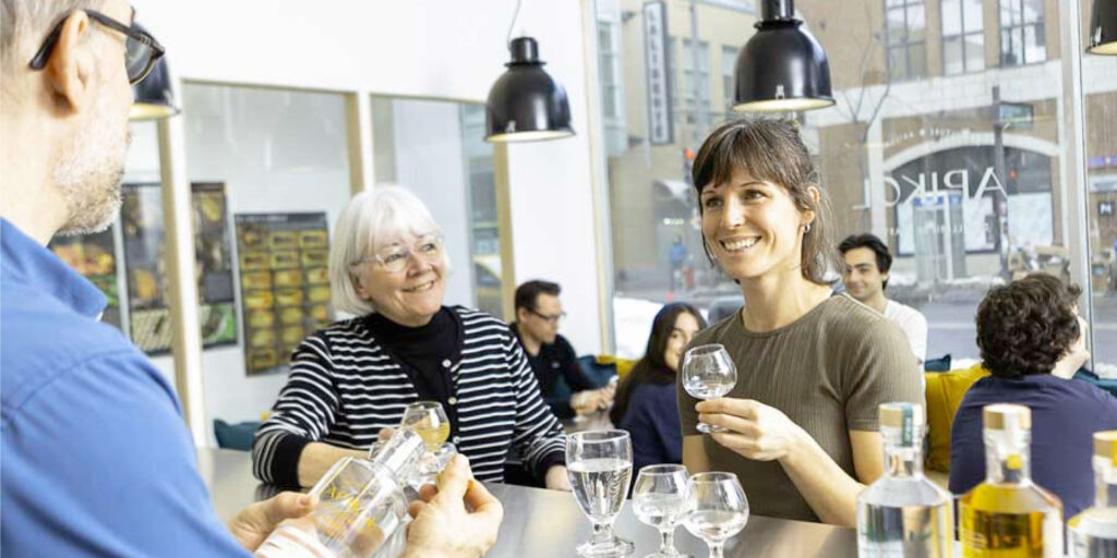 Quebec distillery, crowd participating in tasting